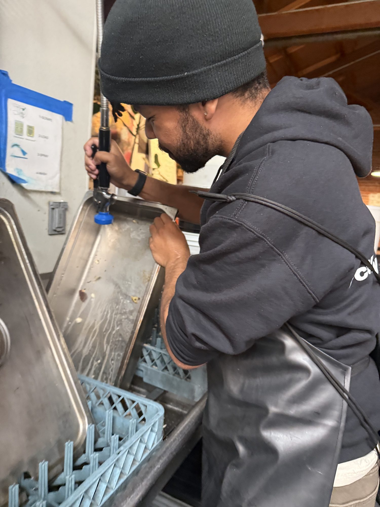 Cardayell helping clean up the kitchen at Martin de Porres